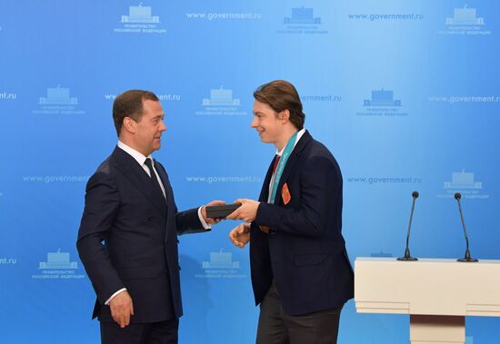 Prime Minister Dmitry Medvedev presents cars to 2018 Winter Olympics medalists at ceremony