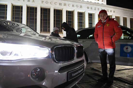 Prime Minister Dmitry Medvedev presents cars to 2018 Winter Olympics medalists at ceremony