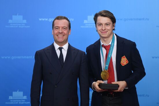 Prime Minister Dmitry Medvedev presents cars to 2018 Winter Olympics medalists at ceremony