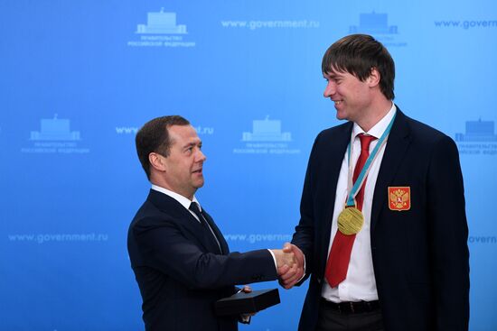 Prime Minister Dmitry Medvedev presents cars to 2018 Winter Olympics medalists at ceremony