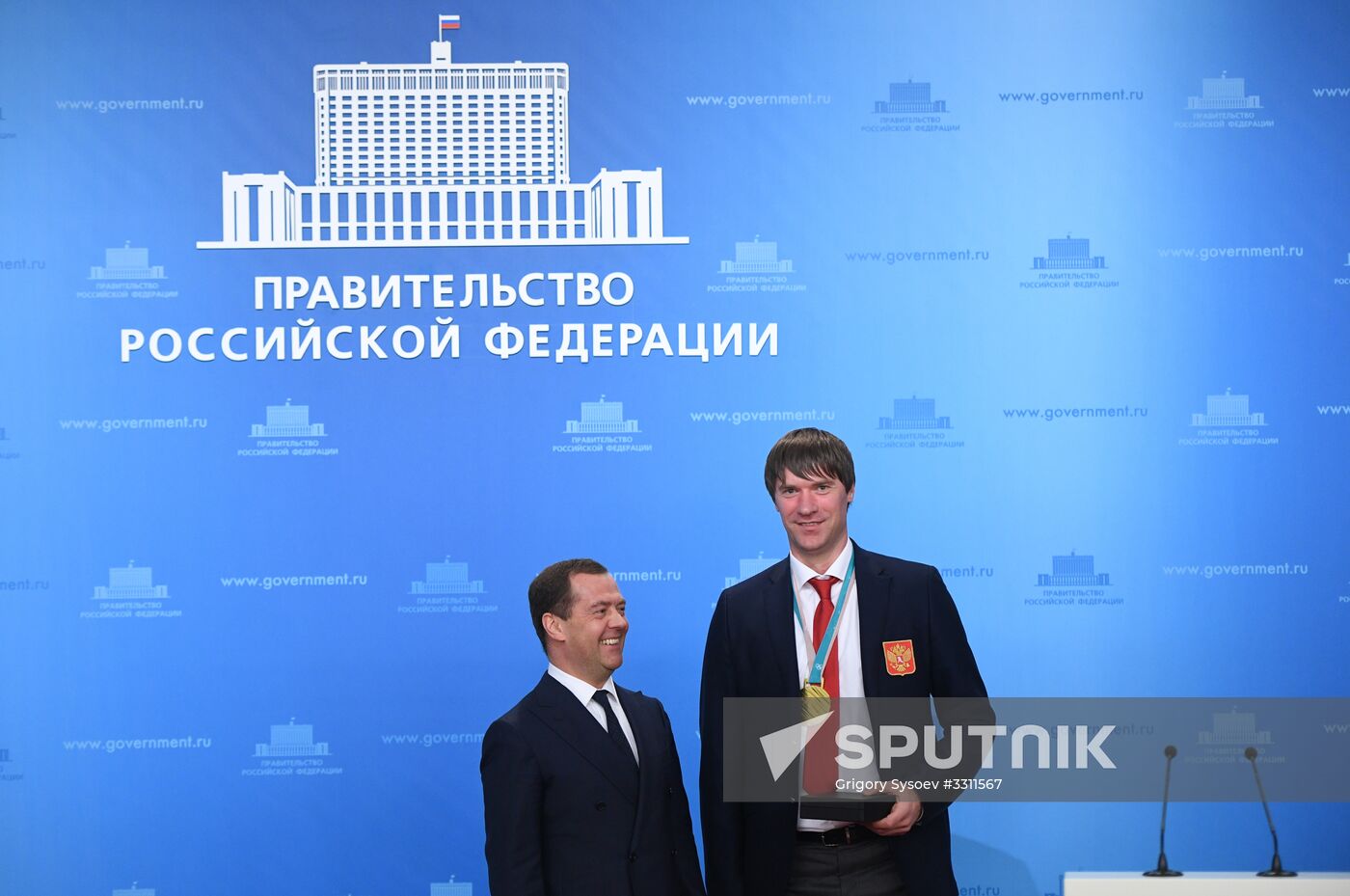Prime Minister Dmitry Medvedev presents cars to 2018 Winter Olympics medalists at ceremony