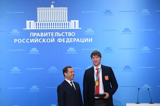 Prime Minister Dmitry Medvedev presents cars to 2018 Winter Olympics medalists at ceremony