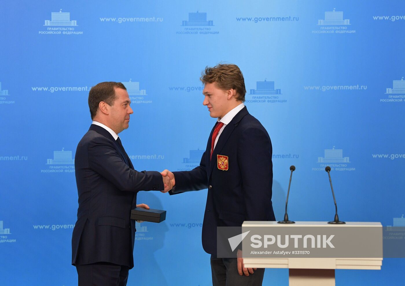 Prime Minister Dmitry Medvedev presents cars to 2018 Winter Olympics medalists at ceremony