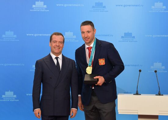 Prime Minister Dmitry Medvedev presents cars to 2018 Winter Olympics medalists at ceremony