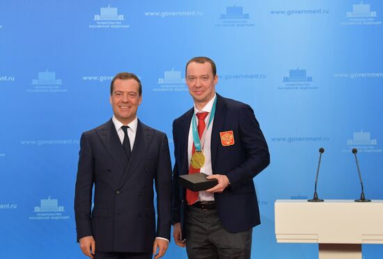 Prime Minister Dmitry Medvedev presents cars to 2018 Winter Olympics medalists at ceremony
