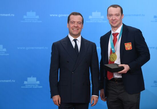 Prime Minister Dmitry Medvedev presents cars to 2018 Winter Olympics medalists at ceremony