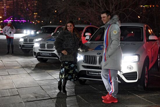 Prime Minister Dmitry Medvedev presents cars to 2018 Winter Olympics medalists at ceremony