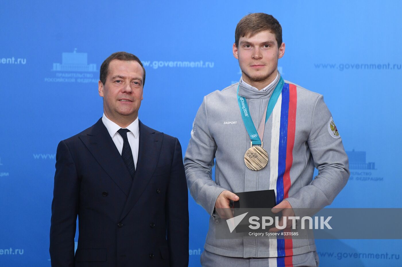 Prime Minister Dmitry Medvedev presents cars to 2018 Winter Olympics medalists at ceremony