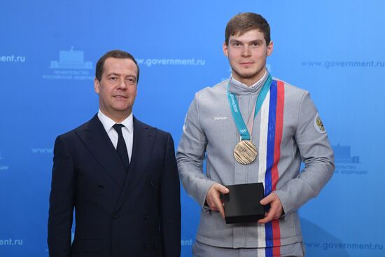 Prime Minister Dmitry Medvedev presents cars to 2018 Winter Olympics medalists at ceremony