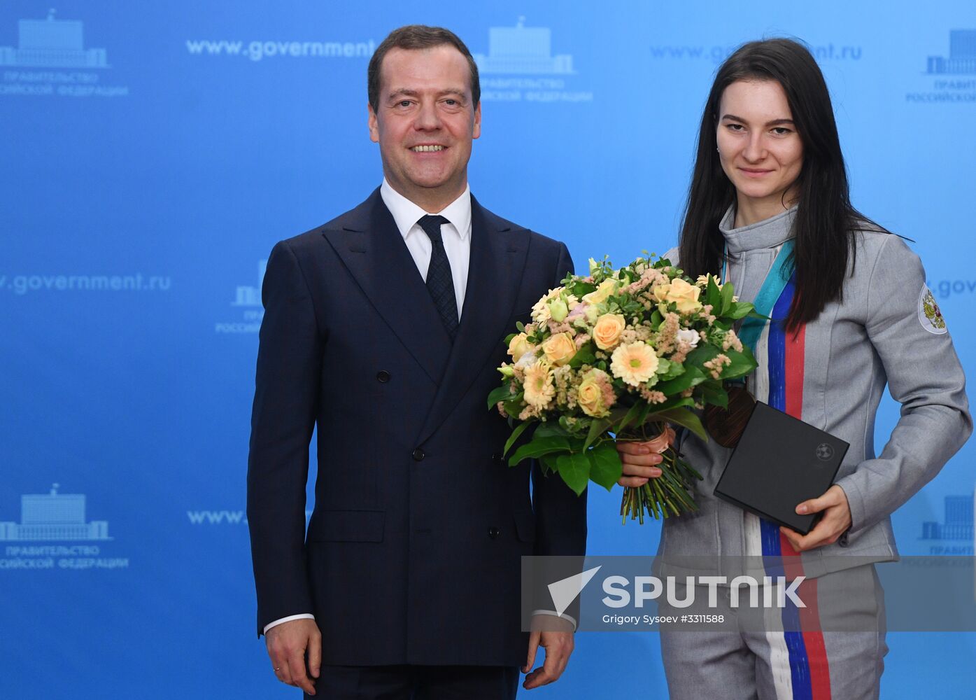 Prime Minister Dmitry Medvedev presents cars to 2018 Winter Olympics medalists at ceremony
