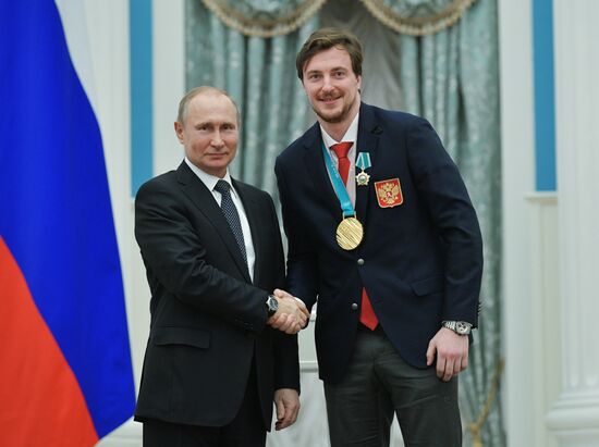 President Vladimir Putin presents state decorations to 2018 Winter Olympics medalists