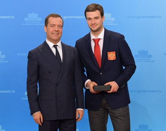 Prime Minister Dmitry Medvedev presents cars to 2018 Winter Olympics medalists at ceremony