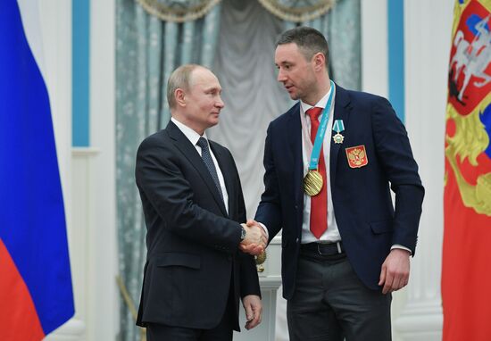 President Vladimir Putin presents state decorations to 2018 Winter Olympics medalists