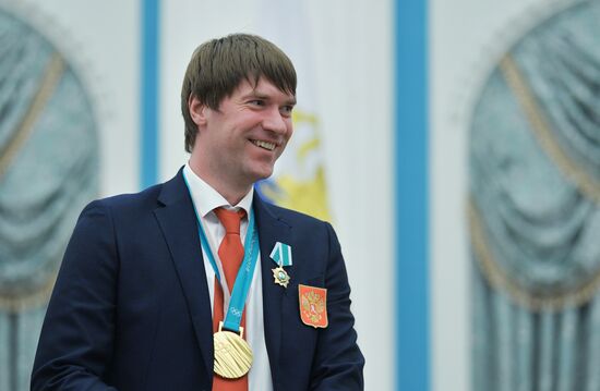 President Vladimir Putin presents state decorations to 2018 Winter Olympics medalists
