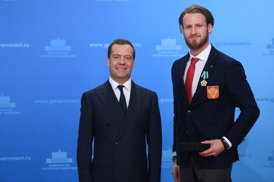 Prime Minister Dmitry Medvedev presents cars to 2018 Winter Olympics medalists at ceremony