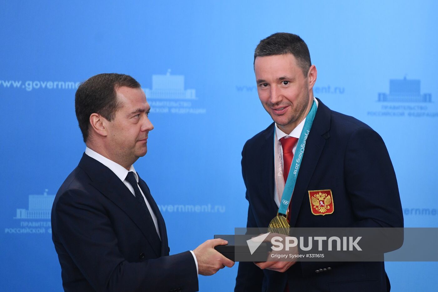 Prime Minister Dmitry Medvedev presents cars to 2018 Winter Olympics medalists at ceremony