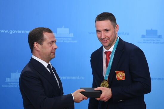 Prime Minister Dmitry Medvedev presents cars to 2018 Winter Olympics medalists at ceremony