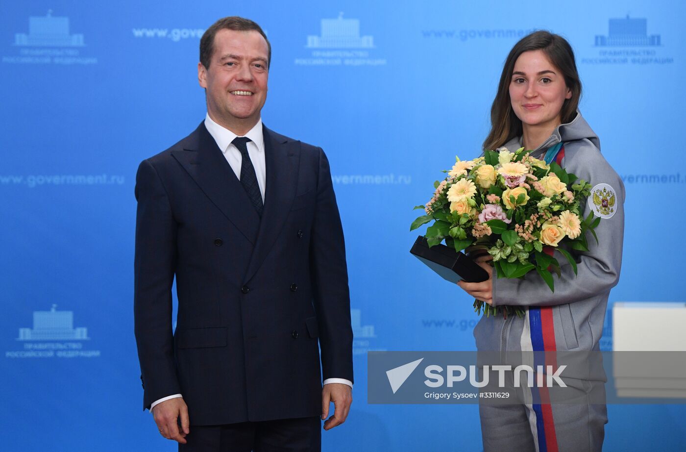 Prime Minister Dmitry Medvedev presents cars to 2018 Winter Olympics medalists at ceremony