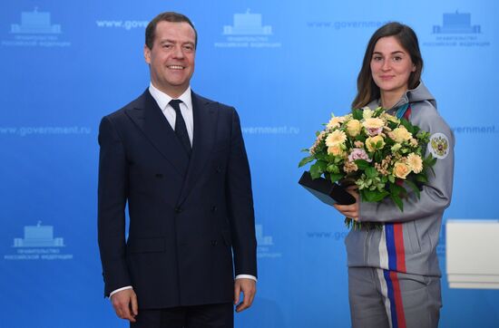 Prime Minister Dmitry Medvedev presents cars to 2018 Winter Olympics medalists at ceremony