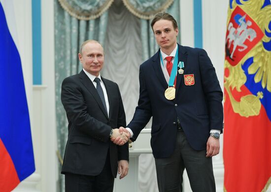 President Vladimir Putin presents state decorations to 2018 Winter Olympics medalists