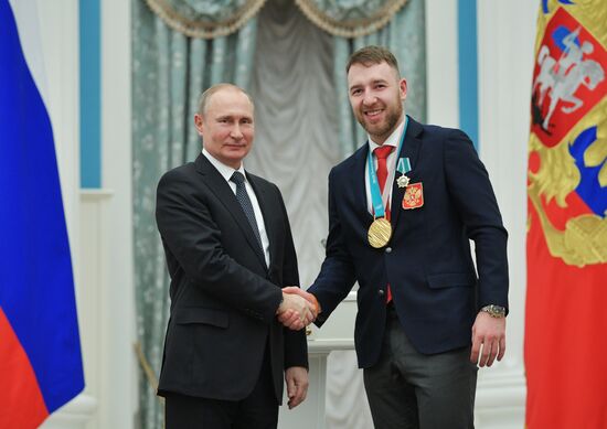 President Vladimir Putin presents state decorations to 2018 Winter Olympics medalists