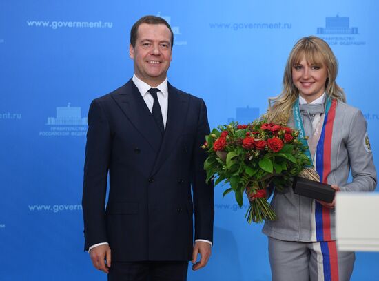 Prime Minister Dmitry Medvedev presents cars to 2018 Winter Olympics medalists at ceremony