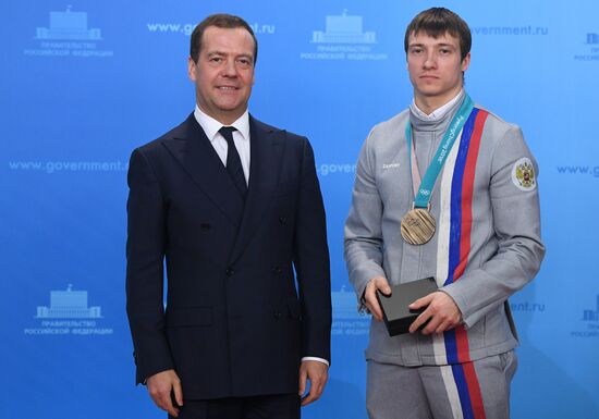 Prime Minister Dmitry Medvedev presents cars to 2018 Winter Olympics medalists at ceremony