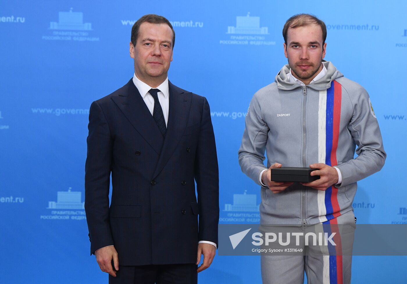 Prime Minister Dmitry Medvedev presents cars to 2018 Winter Olympics medalists at ceremony