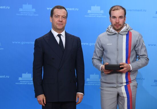 Prime Minister Dmitry Medvedev presents cars to 2018 Winter Olympics medalists at ceremony