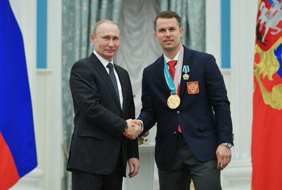 President Vladimir Putin presents state decorations to 2018 Winter Olympics medalists
