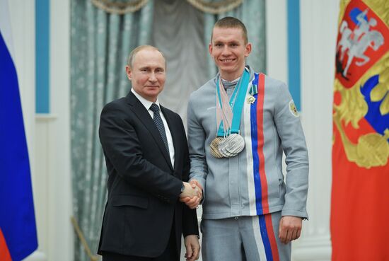 President Vladimir Putin presents state decorations to 2018 Winter Olympics medalists