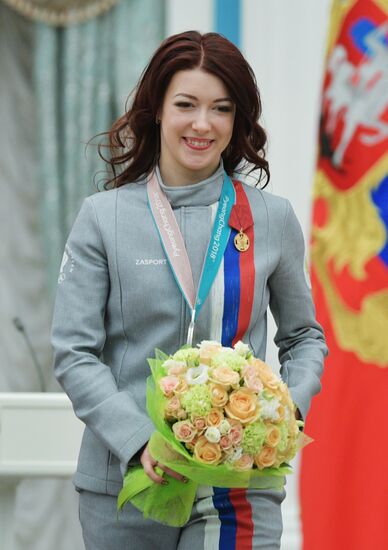 President Vladimir Putin presents state decorations to 2018 Winter Olympics medalists