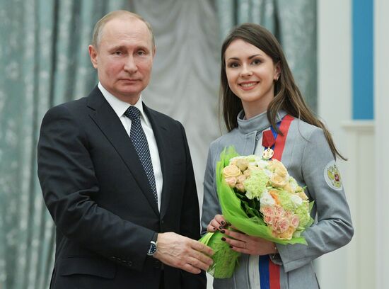 President Vladimir Putin presents state decorations to 2018 Winter Olympics medalists