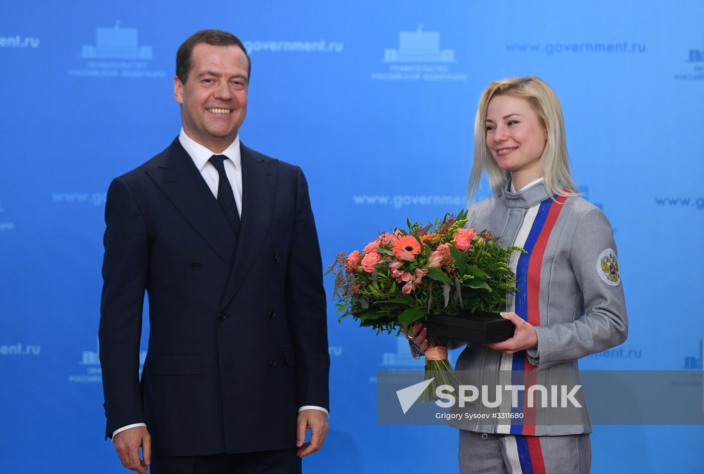 Prime Minister Dmitry Medvedev presents cars to 2018 Winter Olympics medalists at ceremony