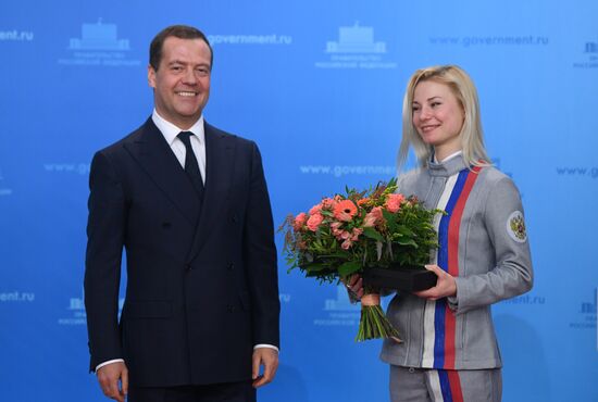 Prime Minister Dmitry Medvedev presents cars to 2018 Winter Olympics medalists at ceremony