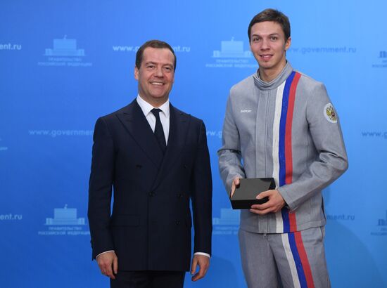 Prime Minister Dmitry Medvedev presents cars to 2018 Winter Olympics medalists at ceremony
