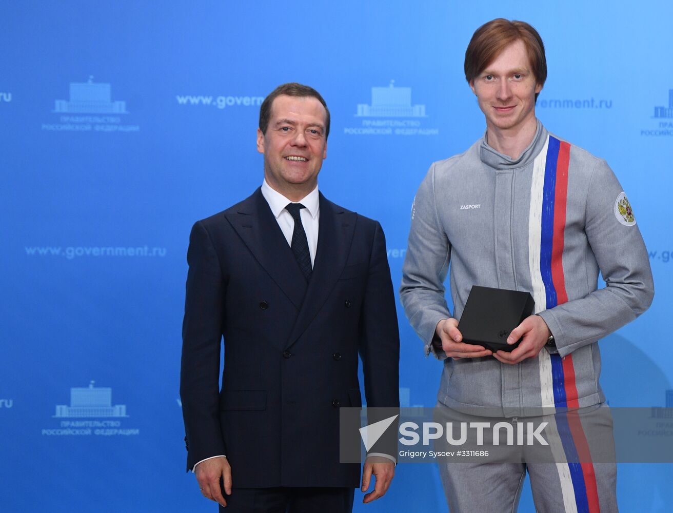 Prime Minister Dmitry Medvedev presents cars to 2018 Winter Olympics medalists at ceremony