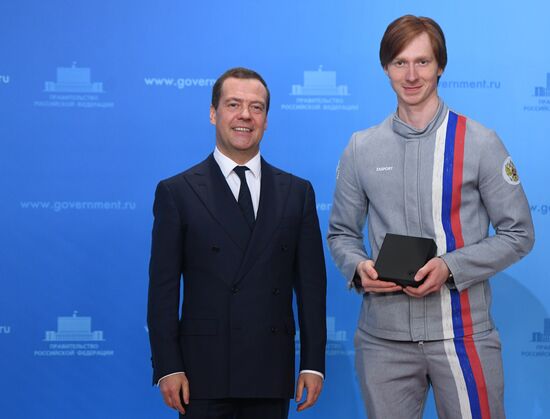 Prime Minister Dmitry Medvedev presents cars to 2018 Winter Olympics medalists at ceremony