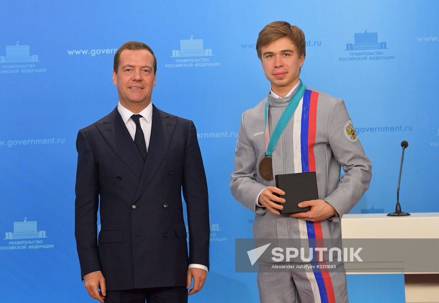 Prime Minister Dmitry Medvedev presents cars to 2018 Winter Olympics medalists at ceremony