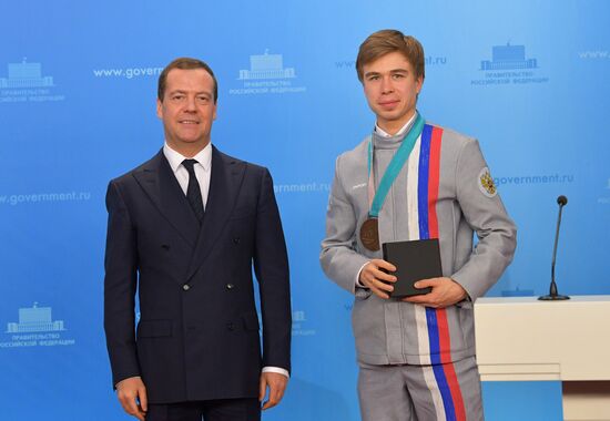 Prime Minister Dmitry Medvedev presents cars to 2018 Winter Olympics medalists at ceremony