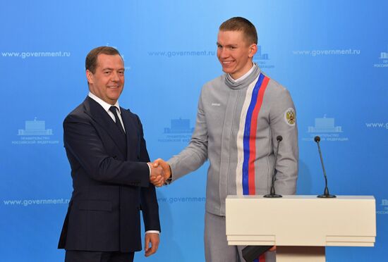 Prime Minister Dmitry Medvedev presents cars to 2018 Winter Olympics medalists at ceremony