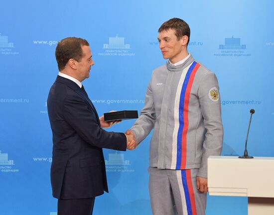 Prime Minister Dmitry Medvedev presents cars to 2018 Winter Olympics medalists at ceremony