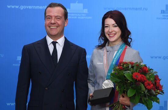 Prime Minister Dmitry Medvedev presents cars to 2018 Winter Olympics medalists at ceremony