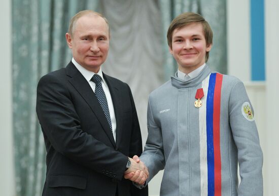 President Vladimir Putin presents state decorations to 2018 Winter Olympics medalists