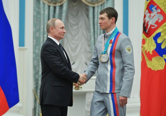 President Vladimir Putin presents state decorations to 2018 Winter Olympics medalists