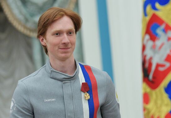 President Vladimir Putin presents state decorations to 2018 Winter Olympics medalists