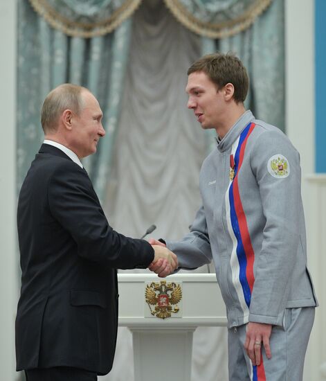 President Vladimir Putin presents state decorations to 2018 Winter Olympics medalists
