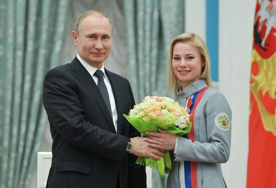 President Vladimir Putin presents state decorations to 2018 Winter Olympics medalists