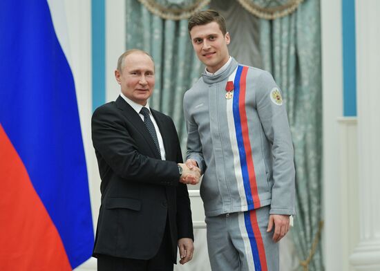 President Vladimir Putin presents state decorations to 2018 Winter Olympics medalists