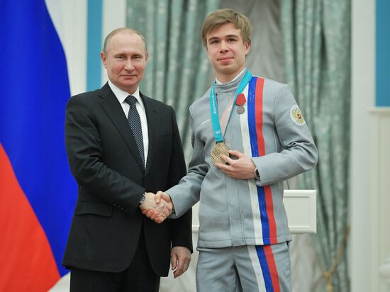 President Vladimir Putin presents state decorations to 2018 Winter Olympics medalists